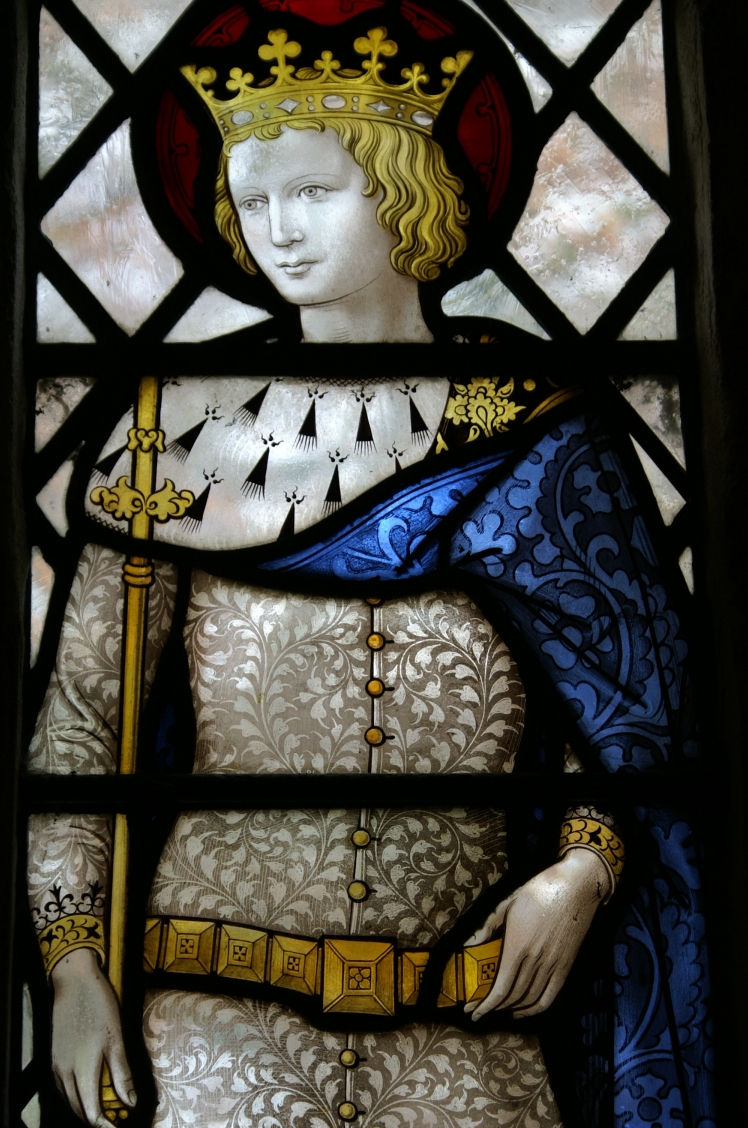 Stained glass window depicting a crowned figure holding a staff representing faith leadership tradition and connection to Catholic heritage