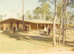 Historic school grounds with buildings and people highlighting the growth and evolution of the school campus